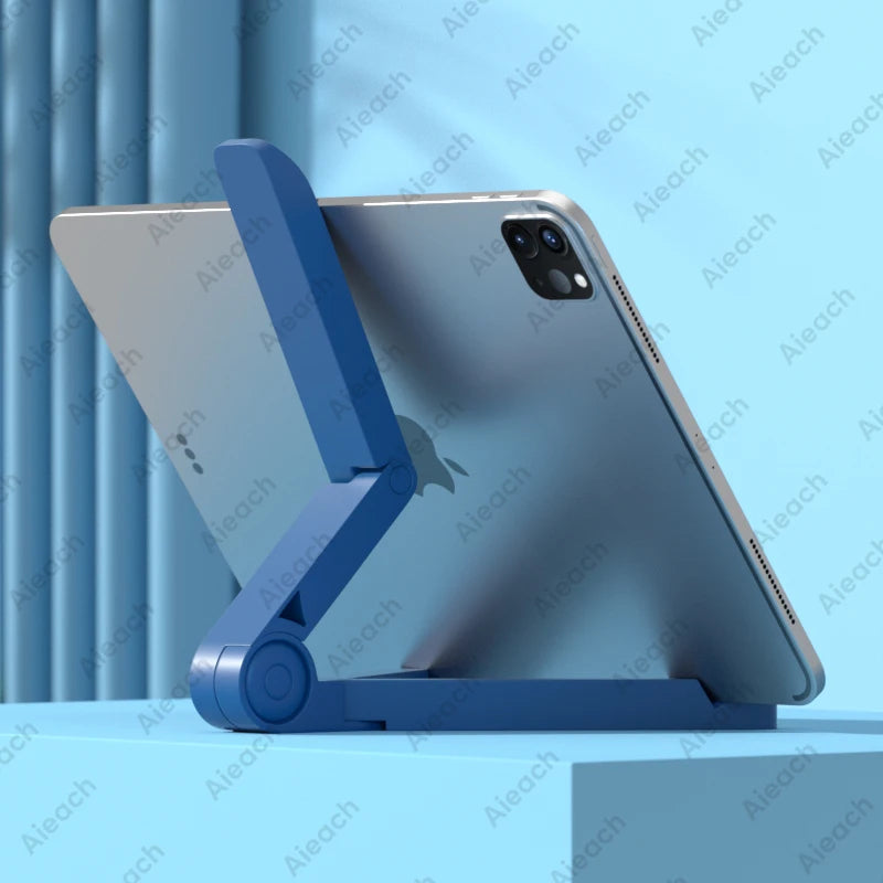 Adjustable folding desk stand holding a tablet